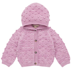 The Hooded Popcorn Cardigan by Misha & Puff. A cozy pink knit cardigan featuring a hood and textured pom-pom details