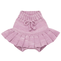 The Skating Pond Skirt from Misha & Puff. A charming pink knit skirt featuring a ruffled hem and an adjustable drawstring