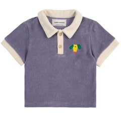 Happy Dog Terry Cloth Polo from Bobo Choses. This navy blue t-shirt is a classic reimagined for modern adventures.