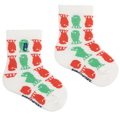 Lucky Fish All Over Short Socks from Bobo Choses. Playful ankle socks featuring a colorful red and green fish pattern.