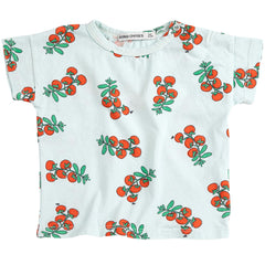 The Juicy Tomatoes All Over Tee from Bobo Choses. Light blue t-shirt with red cherry pattern.