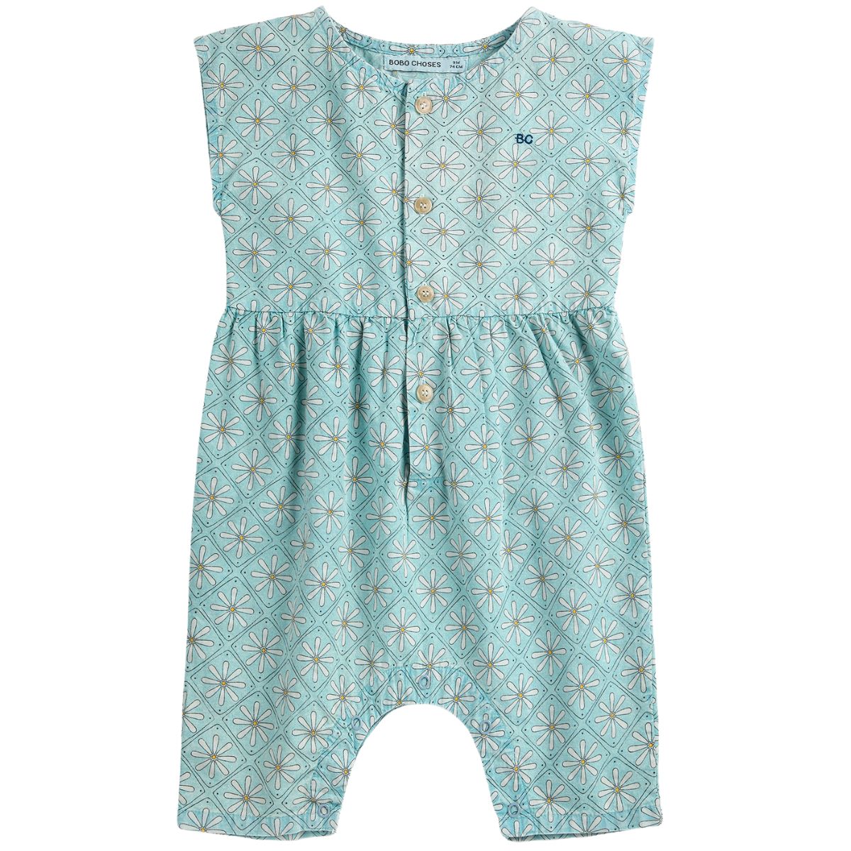 Daisy Mosaic All Over Woven Overall by Bobo Choses in light blue fabric with all-over daisy pattern and front buttons.