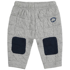 The Quilted Jogging Pants from Bobo Choses. Gray baby's pants with navy knee pads and logo.