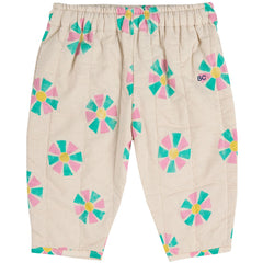 The Kaleidoscope All Over Quilted Pants from Bobo Choses. Beige pants with colorful flower patterns.