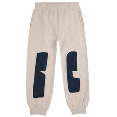 The BC Jogging Pants by Bobo Choses. Off-white sweatpants with navy blue geometric shapes.