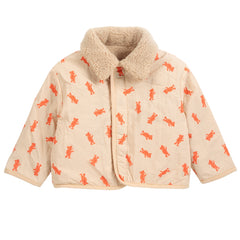 The Softpaw Monster Sheepskin Reversible Jacket from Bobo Choses in beige fleece with orange pockets and bear-print reverse.