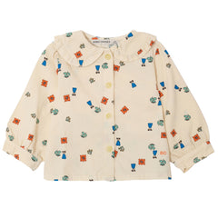 The Blossom All Over Woven Blouse from Bobo Choses in cream woven cotton featuring a ruffle collar and floral vase print.
