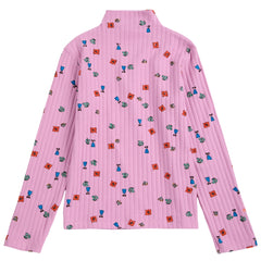 The Blossom All Over Turtleneck Tee in lavender ribbed knit featuring a colorful pattern of mini flowers and figures.