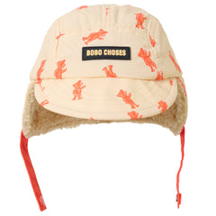 Bobo Choses Softpaw Monster All Over Winter Cap with ear flaps, curved brim and playful monster print for kids.