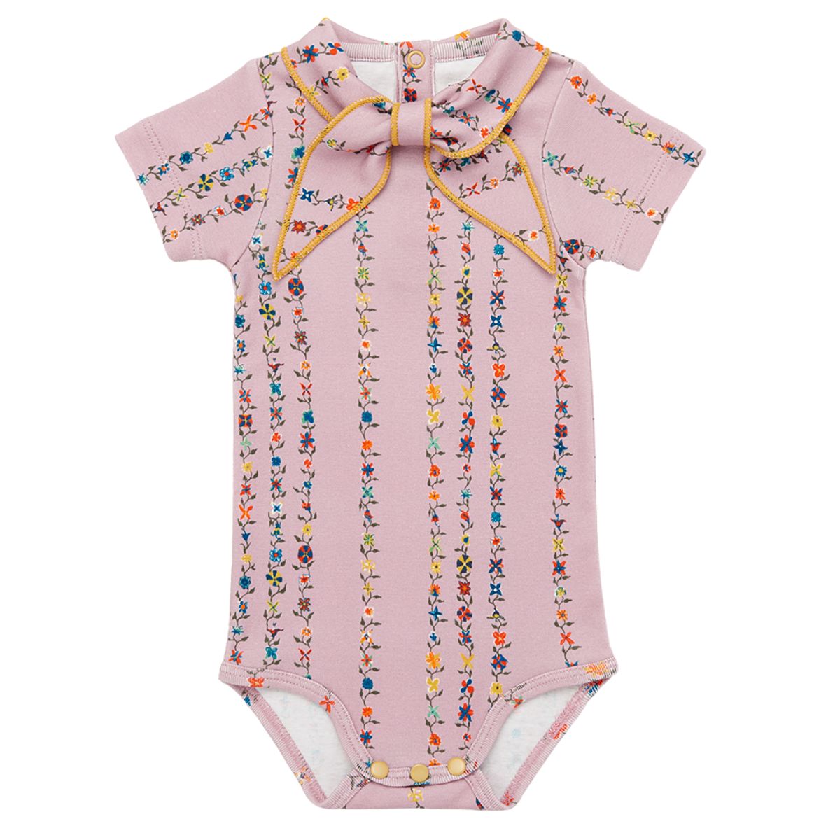The Short Sleeve Scout Onesie from Misha & Puff. A delicate mauve romper adorned with colorful floral stripe patterns.