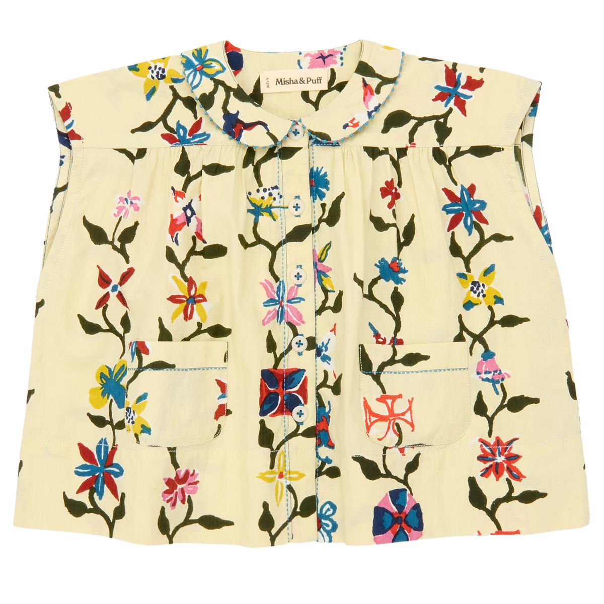 The Nanna Tunic from Misha & Puff. A sleeveless tunic in cotton poplin, featuring a gathered yoke, rounded collar.