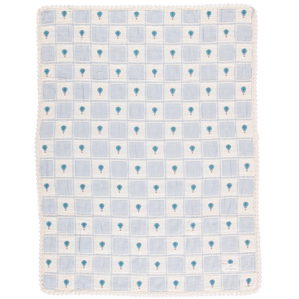 The Balloon Blanket from Bebe Organic featuring a patchwork grid design with hot air balloon motifs and lace border trim.