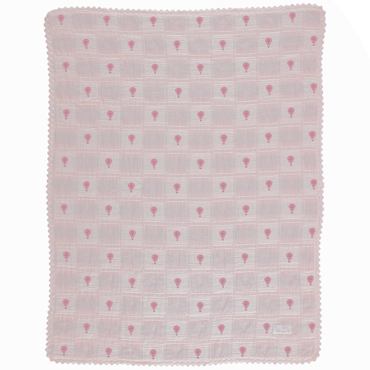 The Balloon Blanket from Bebe Organic featuring a patchwork grid design with hot air balloon motifs and lace border trim.