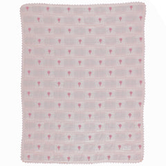 The Balloon Blanket from Bebe Organic featuring a patchwork grid design with hot air balloon motifs and lace border trim.