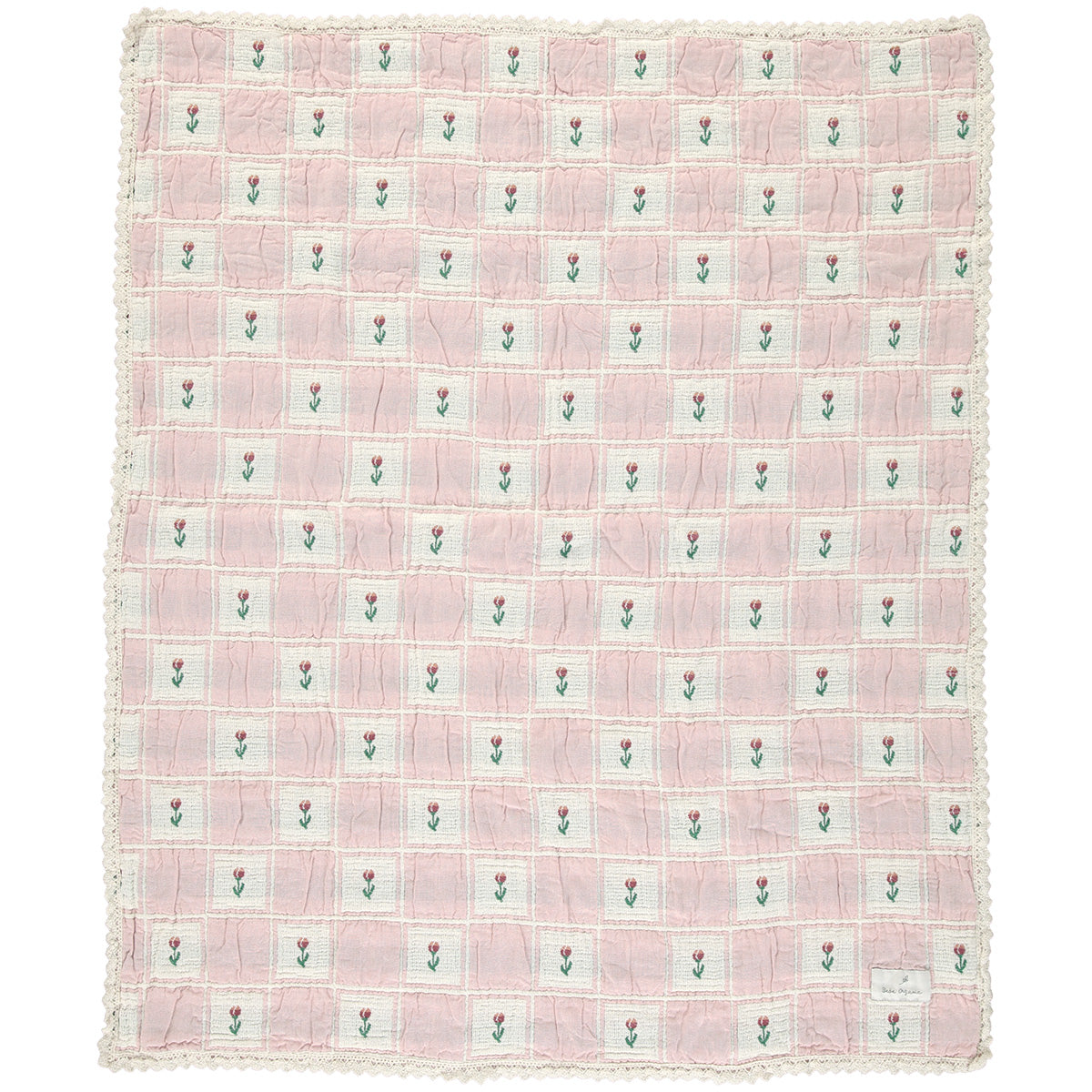 The Bella Blanket from Bebe Organic featuring a floral patchwork jacquard pattern and signature lace edging.