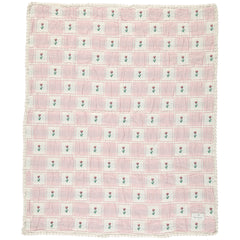 The Bella Blanket from Bebe Organic featuring a floral patchwork jacquard pattern and signature lace edging.