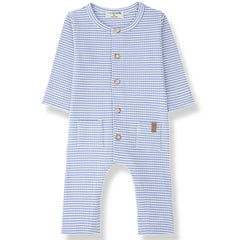 The Cambrils Jumpsuit from 1+ in the Family in ultramarine stripes with front buttons and patch pockets.