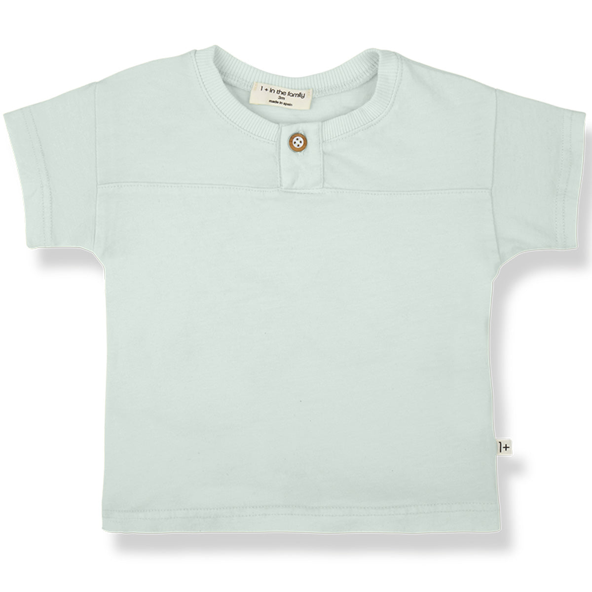 The Ciutadella Tee from 1+ in the Family, a soft baby t-shirt with short sleeves and a button placket at the neckline.