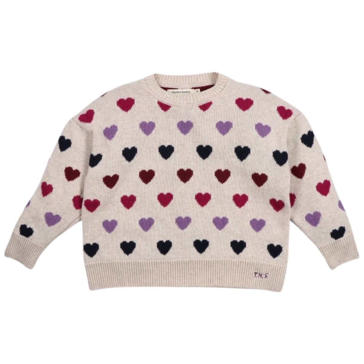 The Cora Sweater from The New Society. Beige sweater with colorful heart pattern on a white background.
