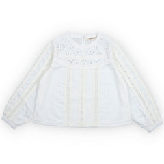 The Dahlia Blouse from The New Society. White blouse with lace details on a white background.