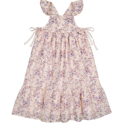 The Caitlyn Cotton Bouquet Dress from Louis Louise with floral print, ruffled straps and ribbon ties.