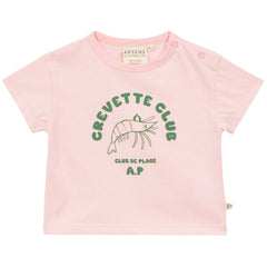 Pink baby T-shirt with shrimp graphic and “Crevette Club” print, short sleeves and shoulder snap buttons.