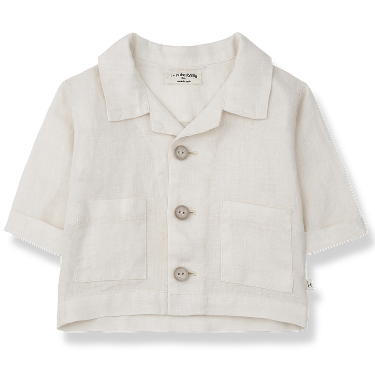 Eneko Jacket by 1+ in the Family. A stylish short-sleeved baby shirt features a classic collar, wooden button closures down the front.