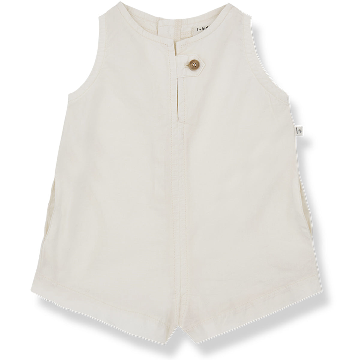 The Flora Short Overall from 1+ in the Family. A sleeveless off-white romper, featuring a front button closure and subtle side pockets.