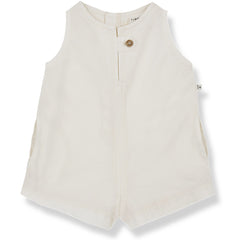 The Flora Short Overall from 1+ in the Family. A sleeveless off-white romper, featuring a front button closure and subtle side pockets.