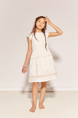 The Four O'clock Dress by The Middle Daughter in white cotton with lace trim and gathered skirt details.