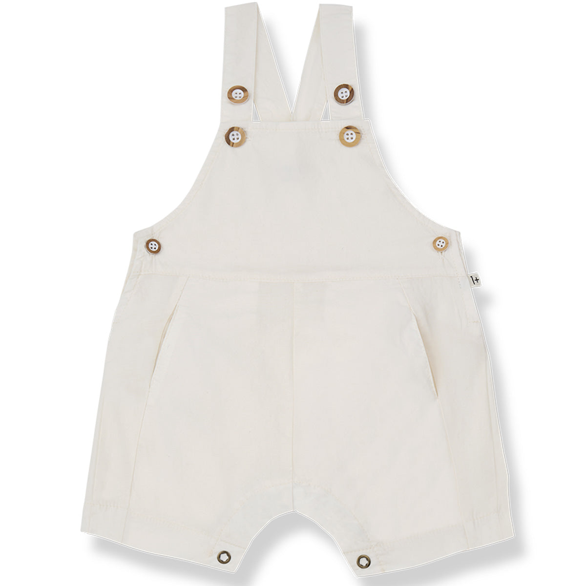 The Galfi Short Dungaree from 1+ in the Family in off-white with button straps, side buttons, and snap closures.