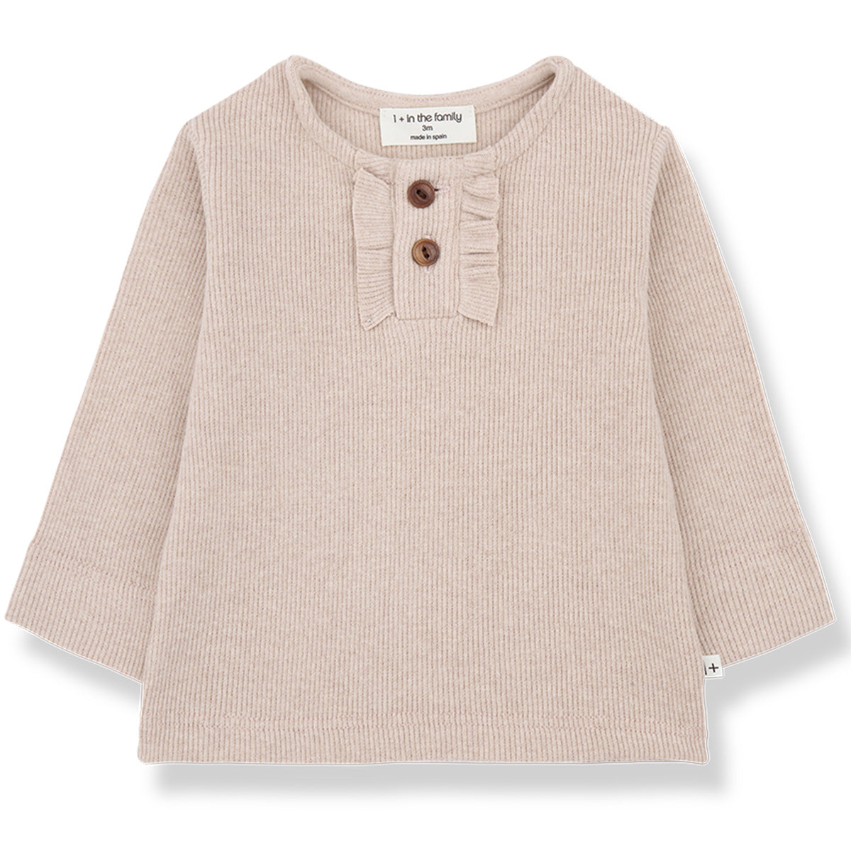 The Greta Tee from 1+ in the Family. Ribbed knit long-sleeve top in soft nude pink with a ruffle trim and front buttons.