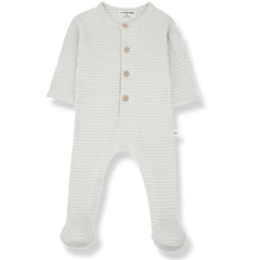The Guim Jumpsuit from 1+ in the Family. A cozy, long-sleeved footed romper with a gingham pattern. Features a button-up front.