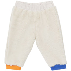 The Baby Tricolor Sherpa Pants from Arsene et Les Pipelettes. White fuzzy pants with orange and blue cuffs.