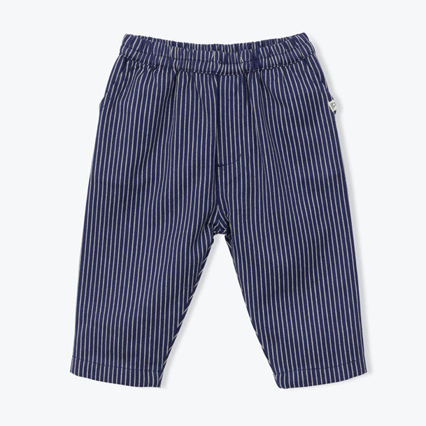 The navy blue Striped Baby Pants from Arsene et Les Pipelettes have an elasticated waist, inset pockets at the side seams, patch pockets at the back with a "Bonjour Arsène &amp; CO" badge on the right pocket, and a small flag label inserted on the front pocket.