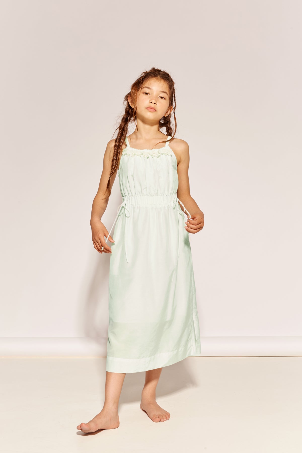 The In Simple English Dress by The Middle Daughter in mint green with delicate straps and gathered waist.