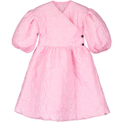 The Bjork Dress from Little Creative Factory in pink with a quilted butterfly pattern and puff sleeves.
