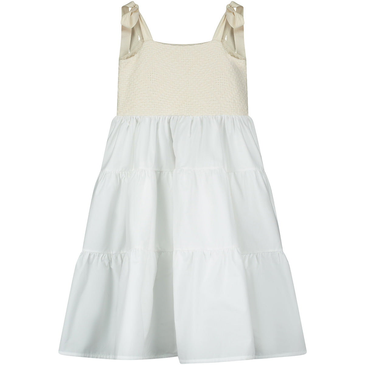 is a sleeveless dress featuring a textured cream bodice with tie straps and a soft tiered white skirt for a light, airy silhouette.