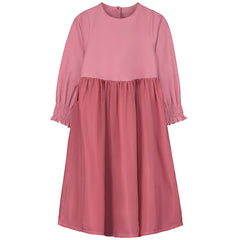 The Forest Dress from Little Creative Factory. A pink dress featuring long sleeves with smocked cuffs.