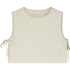 The Iconic Top from Little Creative Factory cream textured sleeveless top with side tie details and minimalist design.
