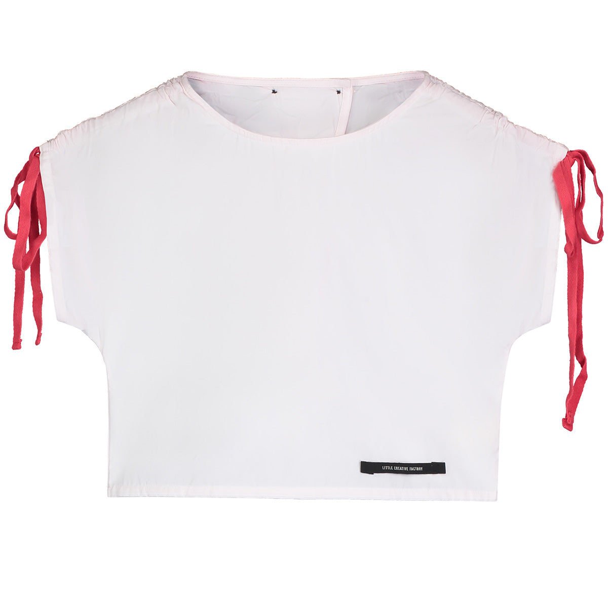 The Magic Top from Little Creative Factory. Cotton top. Lovely fuchsia bow embellishments on each sleeve.