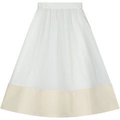 The Cruise Skirt from Little Creative Factory in white with gathered waist and contrast cream hem.