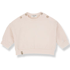 The Kimolos Sweater from 1+ in the Family, a textured baby sweater with shoulder buttons, ribbed cuffs, and hem.