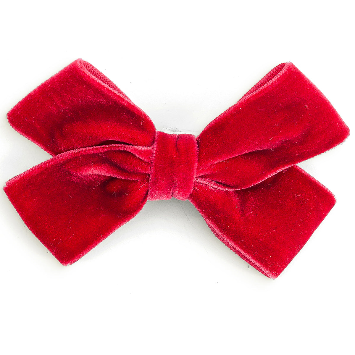 The Knot Pin from Hello Simone featuring a velvet bow with a hair pin for easy styling.