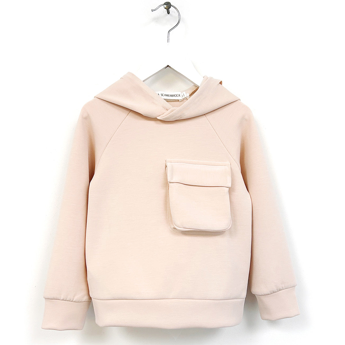 The Lodin Hoodie from Anja Schwerbrock. Kids’ hoodie with a relaxed fit, long sleeves, and a large front flap pocket detail.