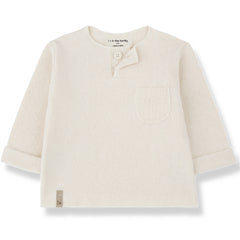 The Mathias Tee from 1+ in the Family. Knit long-sleeve top with a single button at the neckline and a small patch pocket.