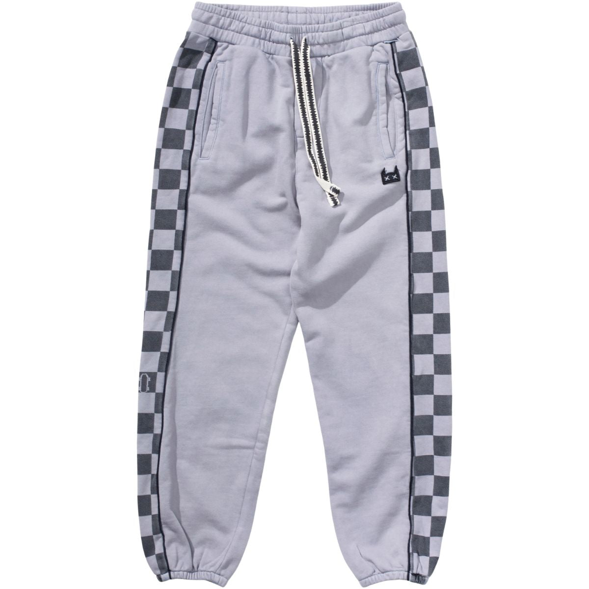 The Player Pant from Munster. Light grey kids’ joggers with checkered side panels, elastic waist with drawstring.