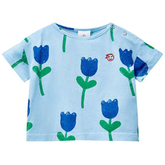 The Mini Kite Tee from Wynken. Relaxed fit baby tee with a dropped short sleeve with vibrant all-over tulip print.