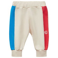 Mini Keel Pant from Wynken. Blouson style sweat pant with bright color blocks that bring a sporty nostalgia.