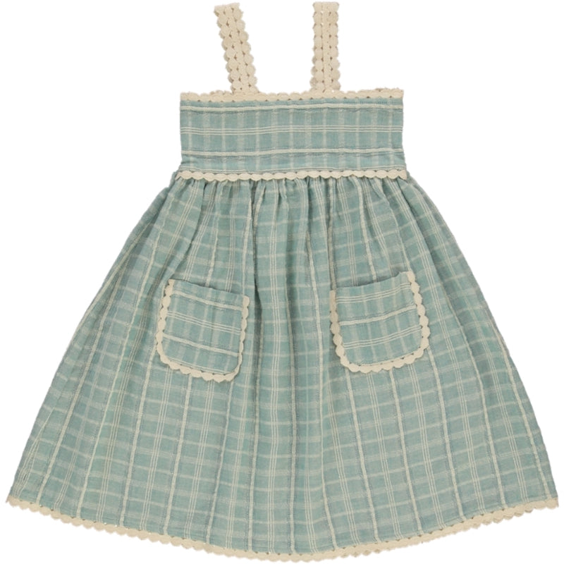 The Mia Dress by Bebe Organic, light blue check cotton kids dress with lace trim straps, gathered waist, and front pockets.